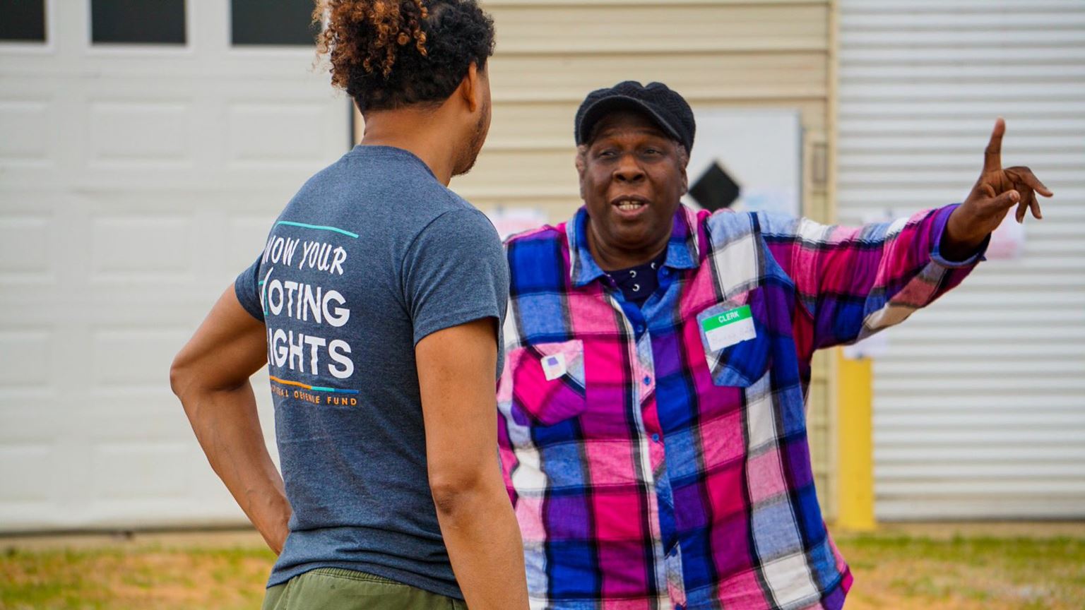 Volunteer engaged in a discussion with a voter