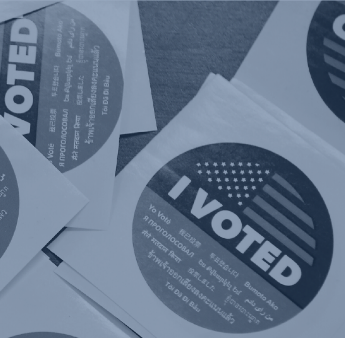 Stickers that read "I voted" in many languages